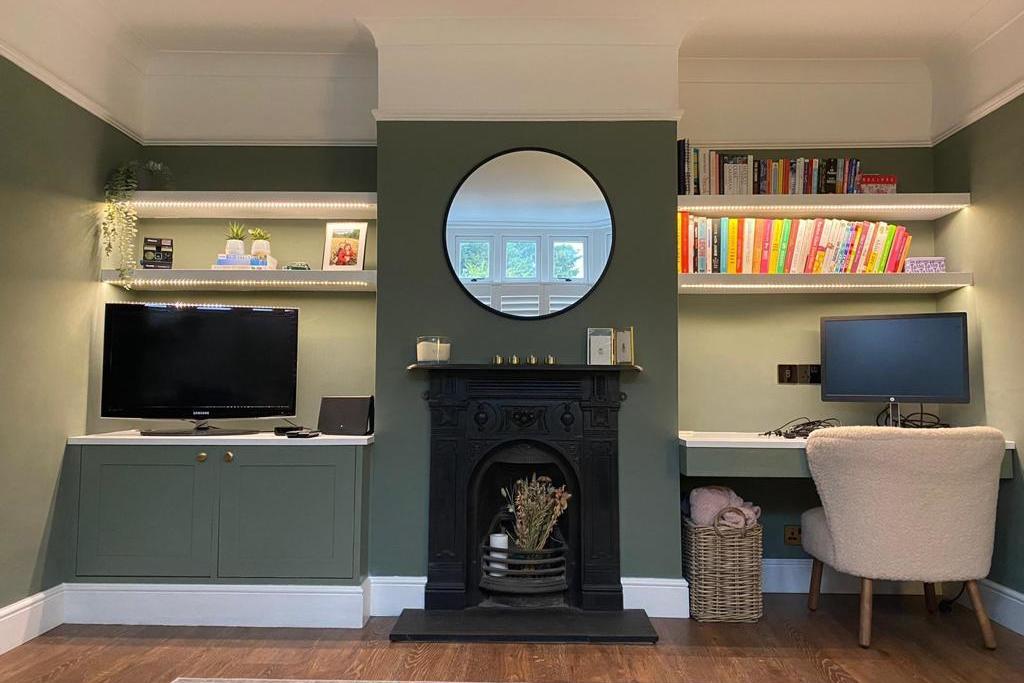 dark green alcove units shelving and desk in hertfordshire home