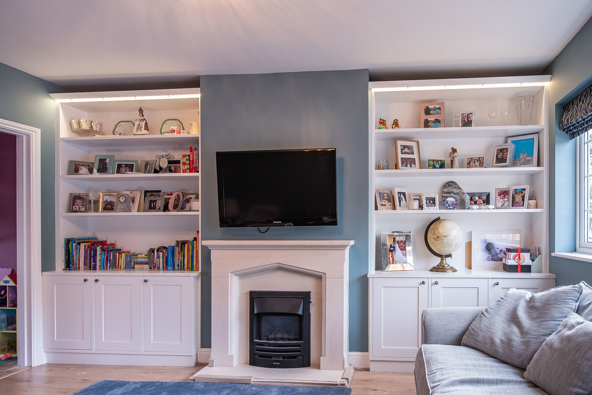 white alcove shelving and floor units in hertfordshire home